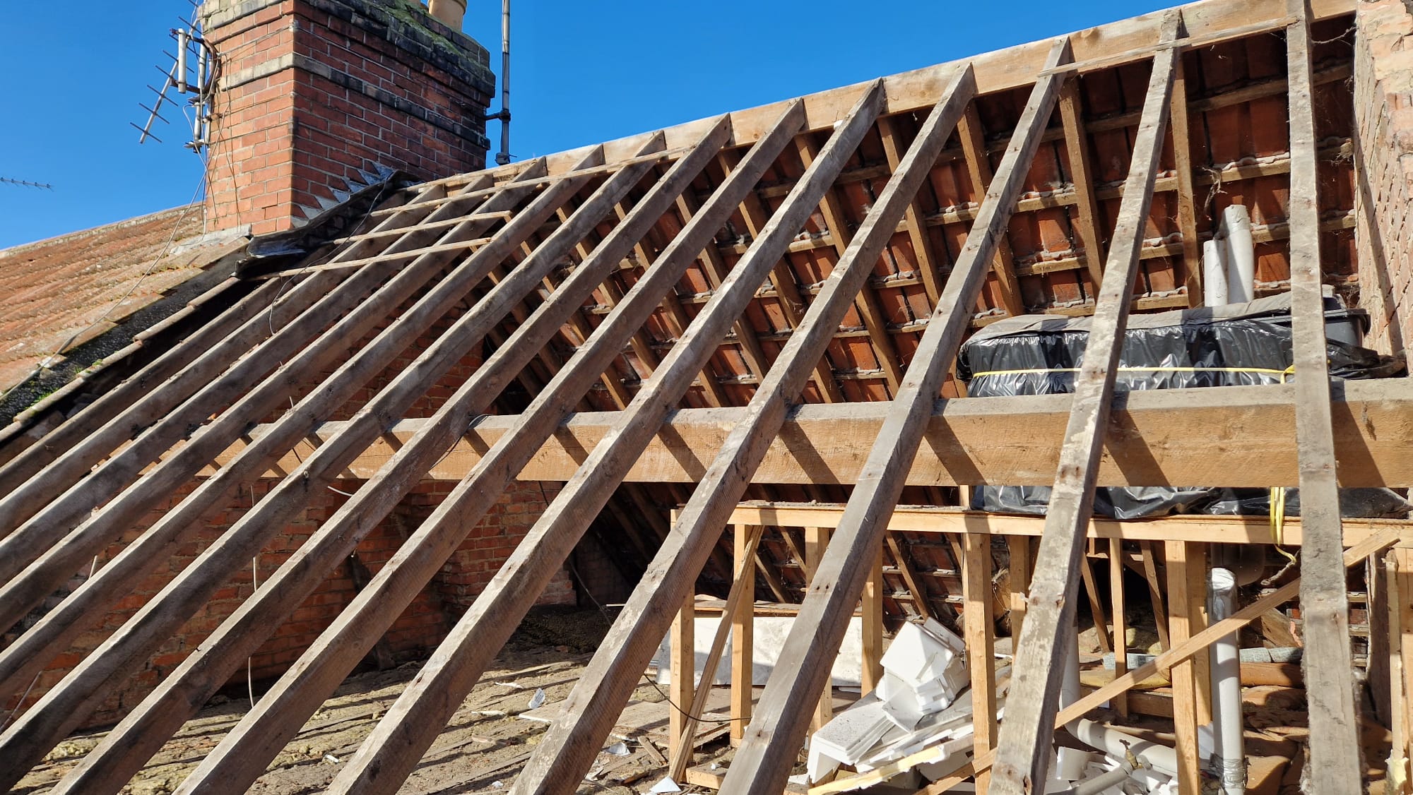 Roof stripped back to rafters before work began