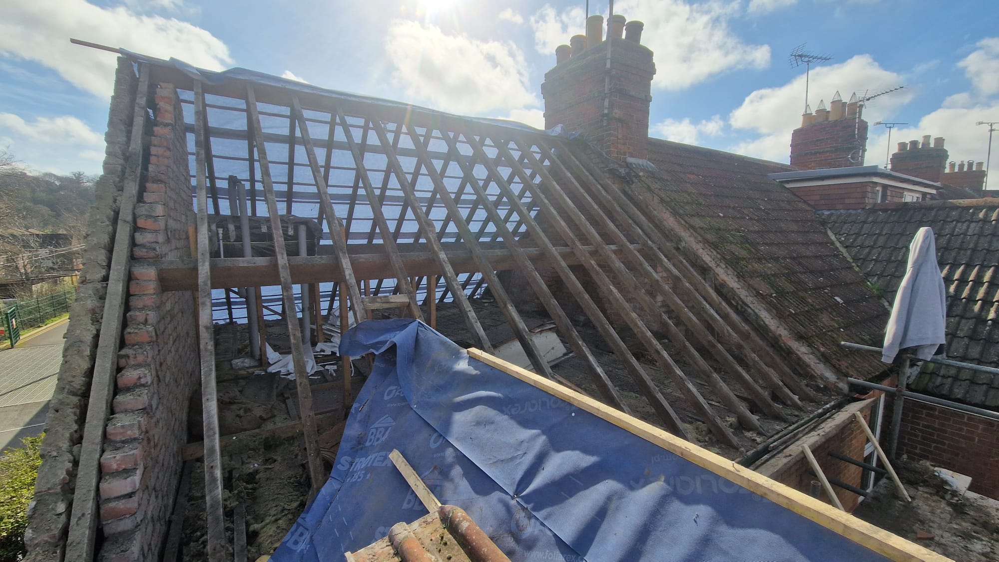 Rear roof stripped back to bare rafters ready for felt and battens