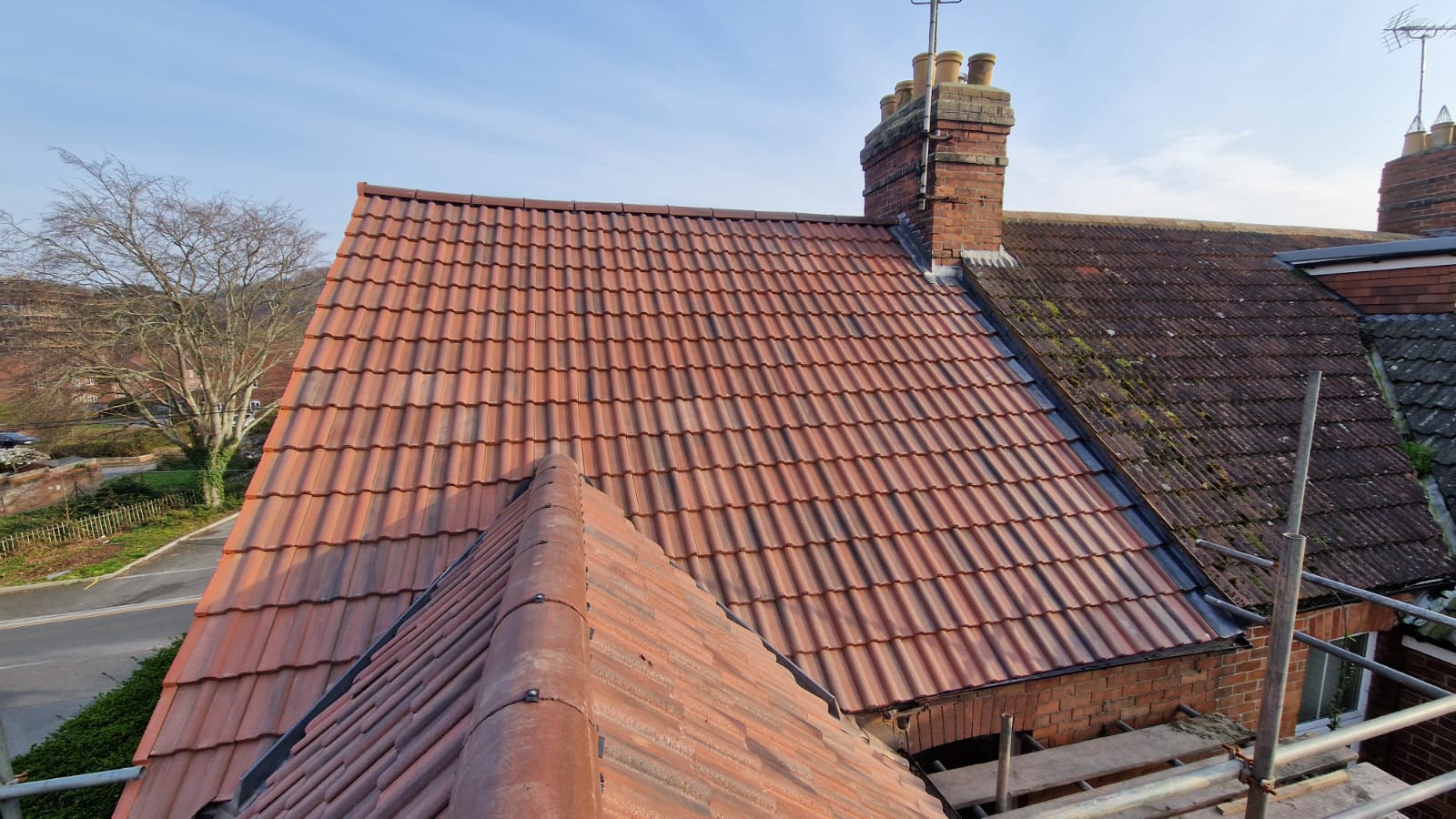 Front elevation tiled while rear roof prepared for tiling